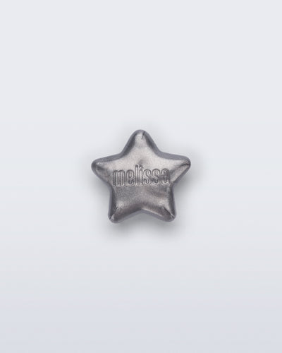 Front view of a silver star shoe charm