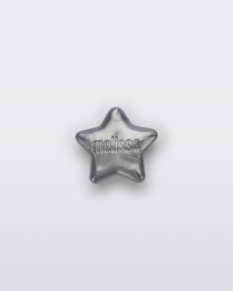 Front view of a silver star shoe charm
