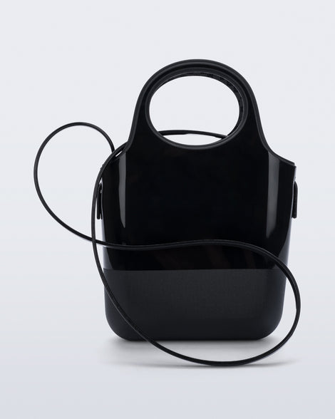 Side view of a black Ultra Bag with handle and strap