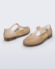 Back and angled view of a pair of milky beige Aranha 79 flats with buckle