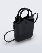 Angled view of a black Ultra Bag with handle and strap
