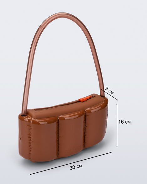 Angled view of a brown Airflow bag with shoulder strap with bag dimensions 30 cm x 9 cm x 16 cm