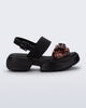 Side view of a black Push platform Sandal with tortoise colored strap