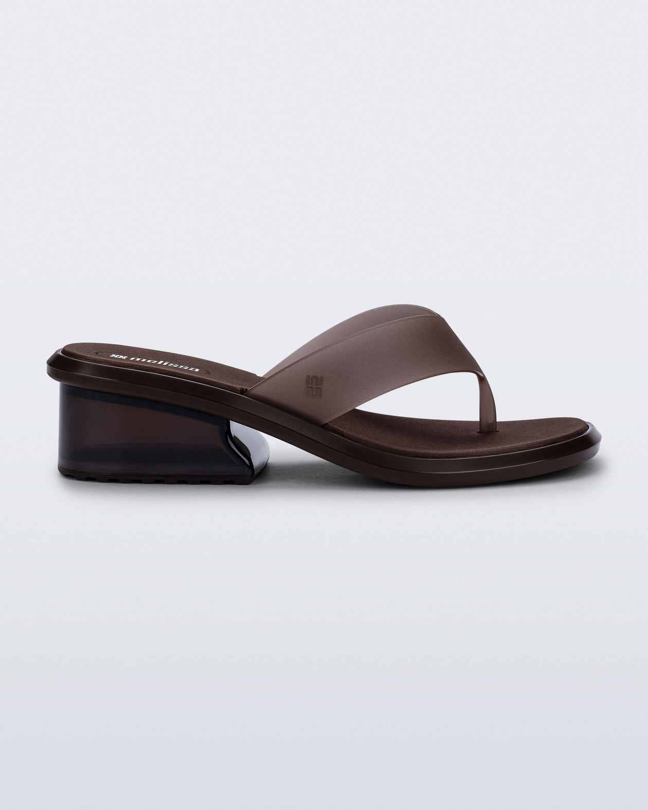 Side view of a brown Margot flip flop with low heel 