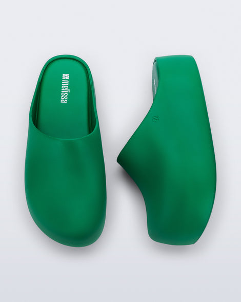 Side and top view of a pair of green Free Clog Up Platforms