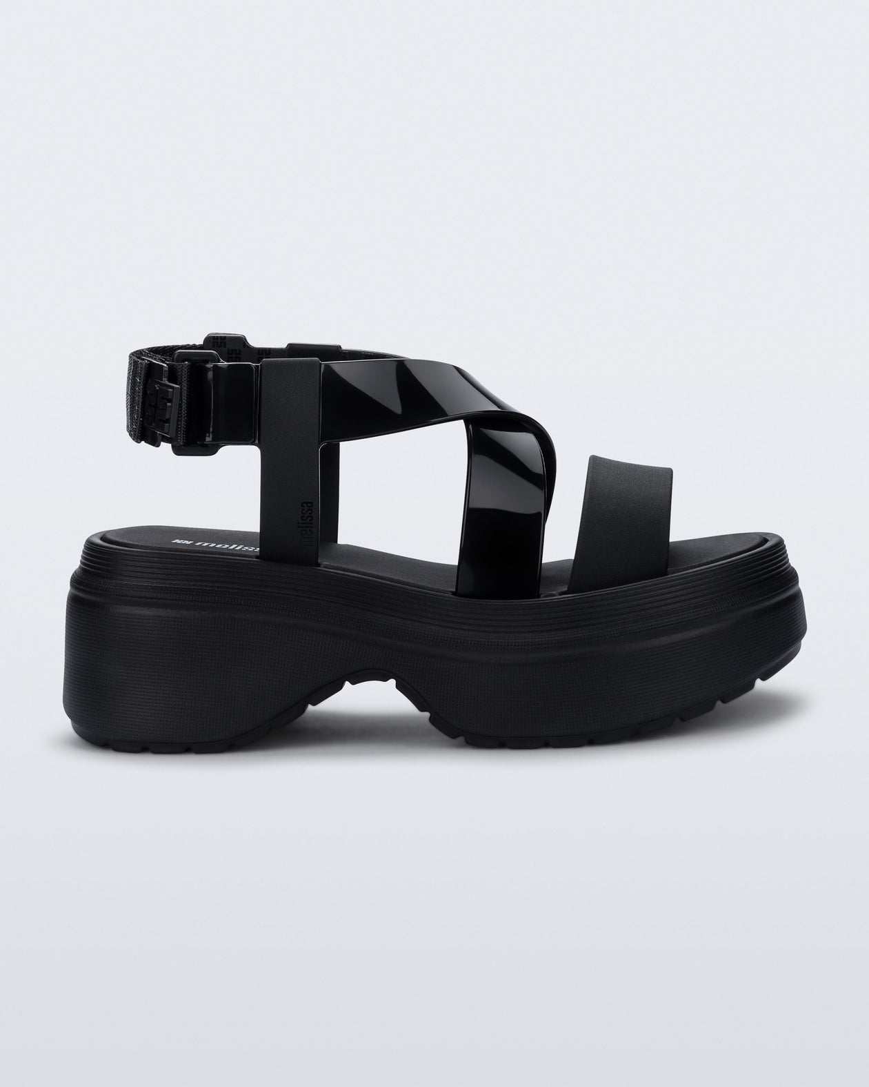 Side view of a black Stand platform sandal