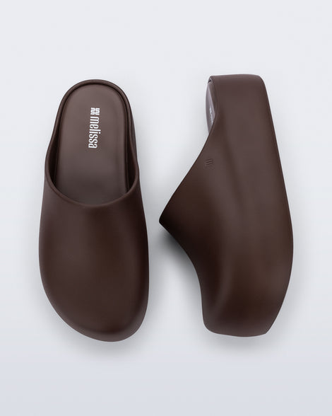 Side and top view of a pair of brown Free Clog Up Platforms