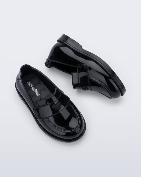 Back and top view of a pair of black Royal Love baby loafers