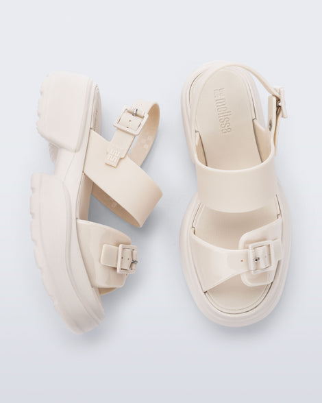 Top and side view of a pair of beige Push platform Sandals
