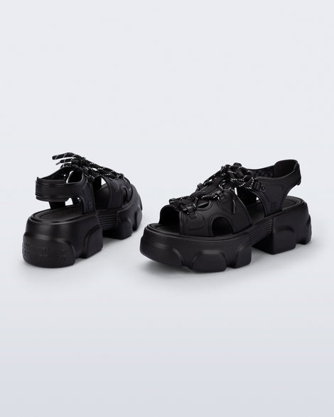 Back and angled view of a pair of black Camp platform sandals with black laces