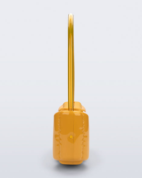 Side view of a yellow Airflow bag with shoulder strap