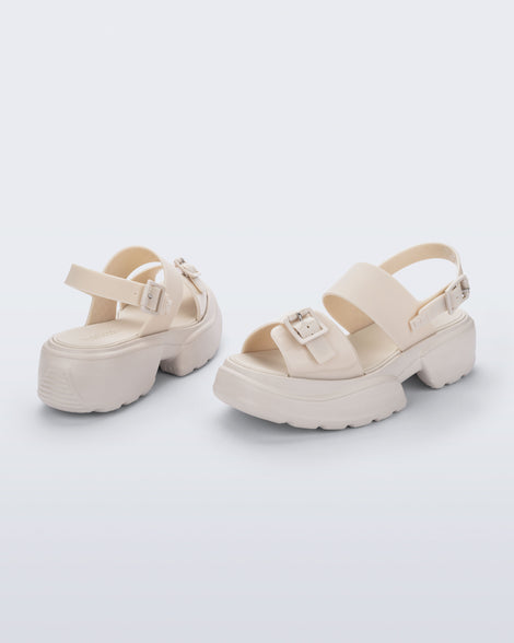Back and angled view of a pair of beige Push platform Sandals