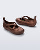 Back and angled view of a pair of bronze Aira flats with top straps