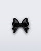 Front view of a black bow shoe charm