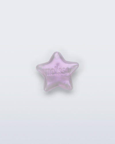 Front view of a pearly lilac star shoe charm