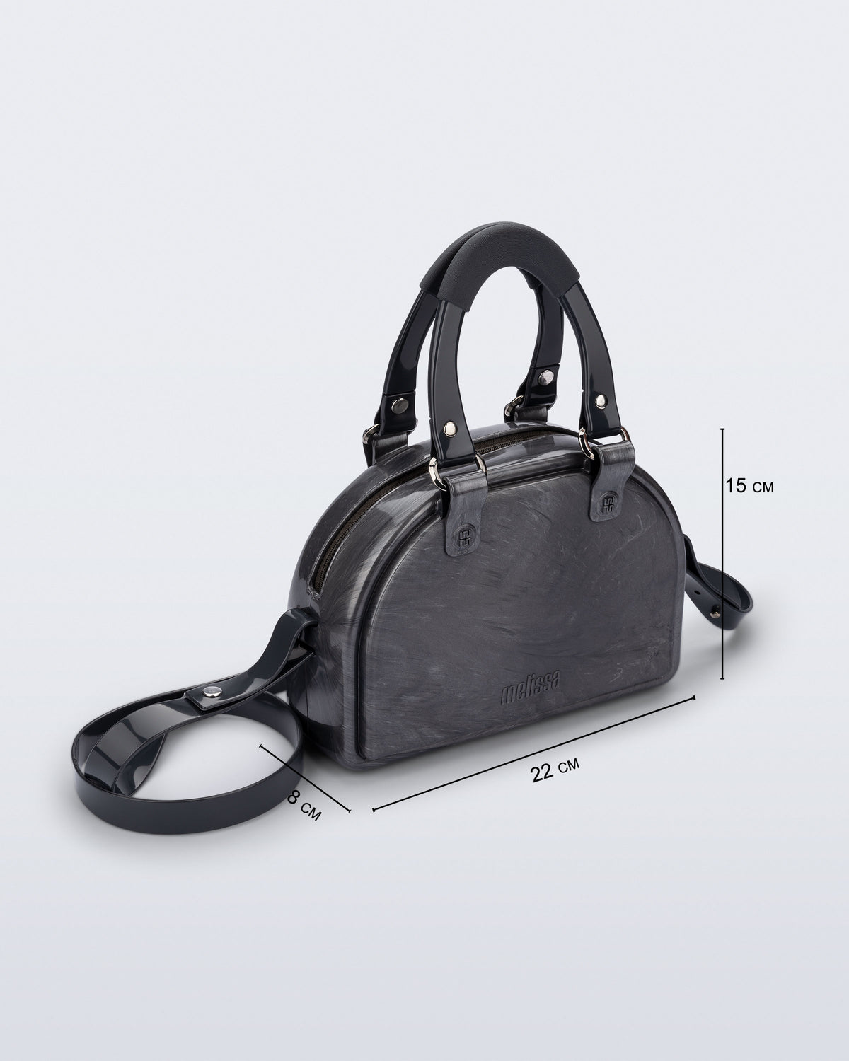 Angled view of a grey Bowling bag with black handle strap and cross body strap with bag dimensions of 22cm x 8cm x 15cm