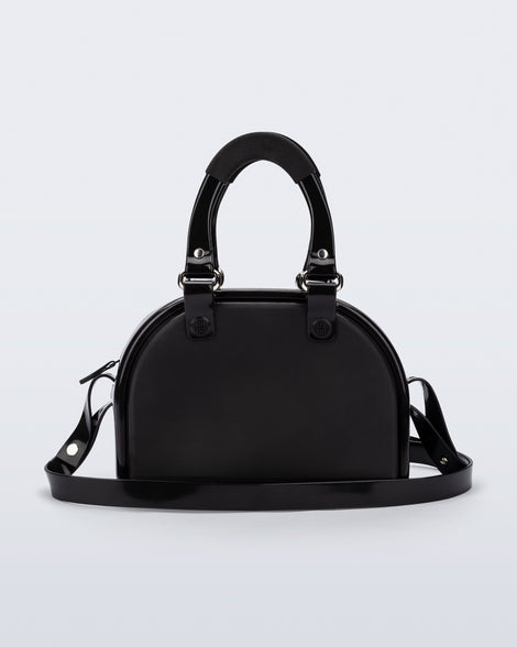 Back view of a black Bowling bag with handle strap and cross body strap