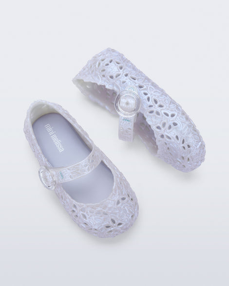 Top and side view of a pair of pearly blue Pollen baby flats