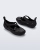 Back and angled view of a pair of black Aira flats with top straps