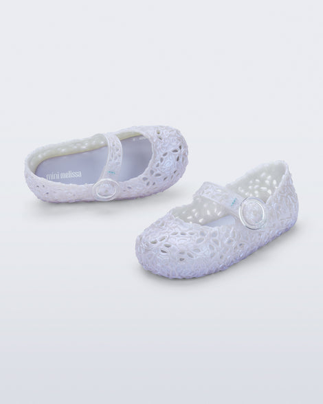 Top and angled view of a pair of pearly blue Pollen baby flats