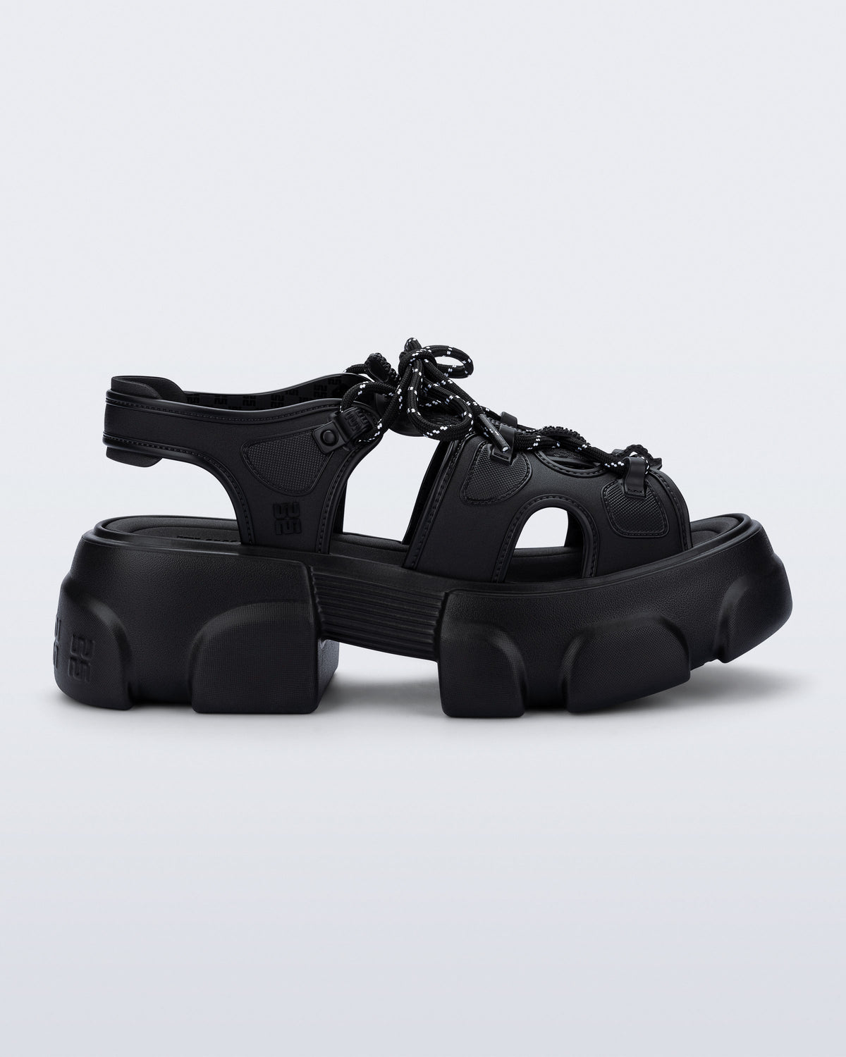 side view of a black Camp platform sandal with black laces