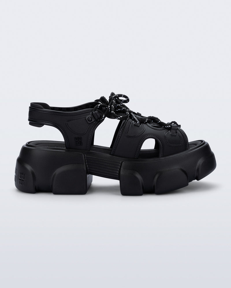side view of a black Camp platform sandal with black laces