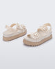 Back and angled view of a pair of beige Cozy Sandal Platforms