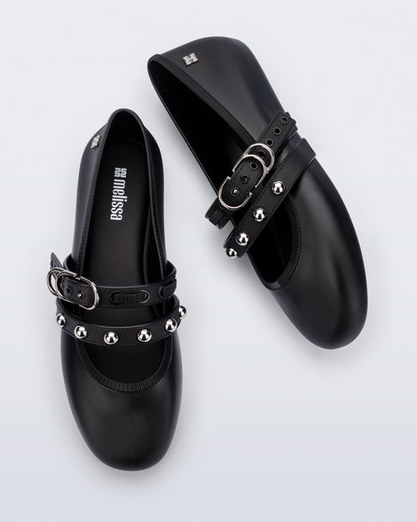 Top and side view of a pair of black Soft Ballerina Studs flats with silver embellishments