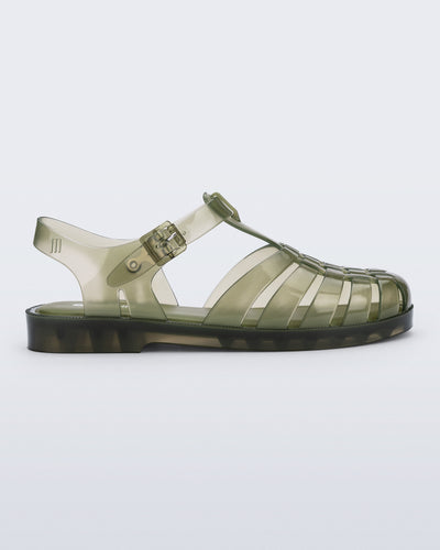 Side view of a clear dark green Possession fisherman sandal