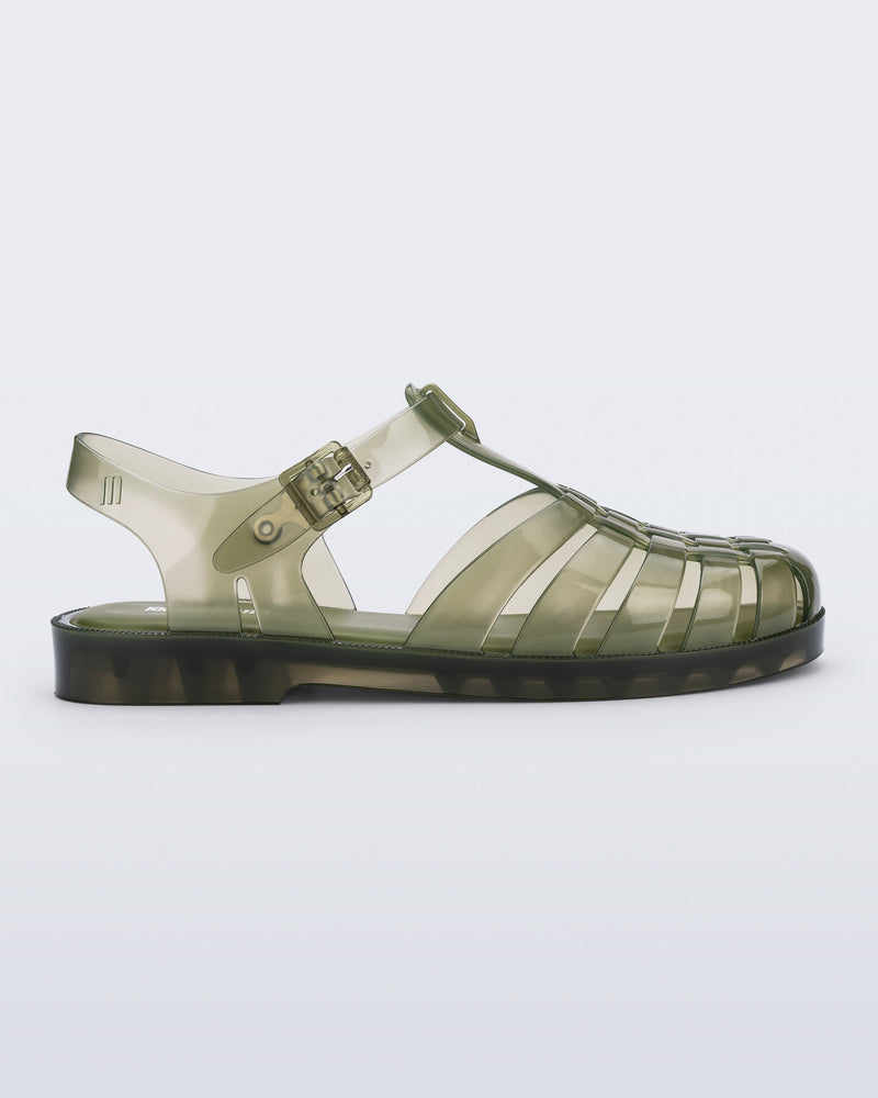 Side view of a clear dark green Possession fisherman sandal