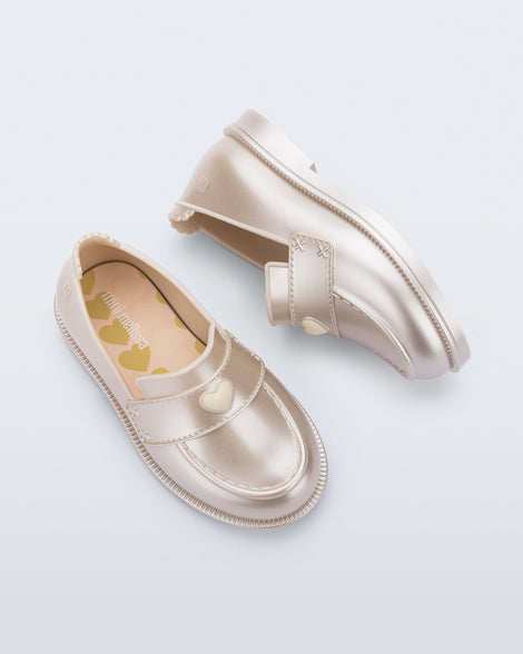 Back and top view of a pair of metallic beige Royal Love baby loafers