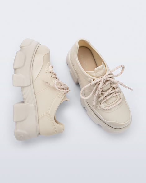 Top and side view of a pair of beige Camp platform Sneakers with beige laces