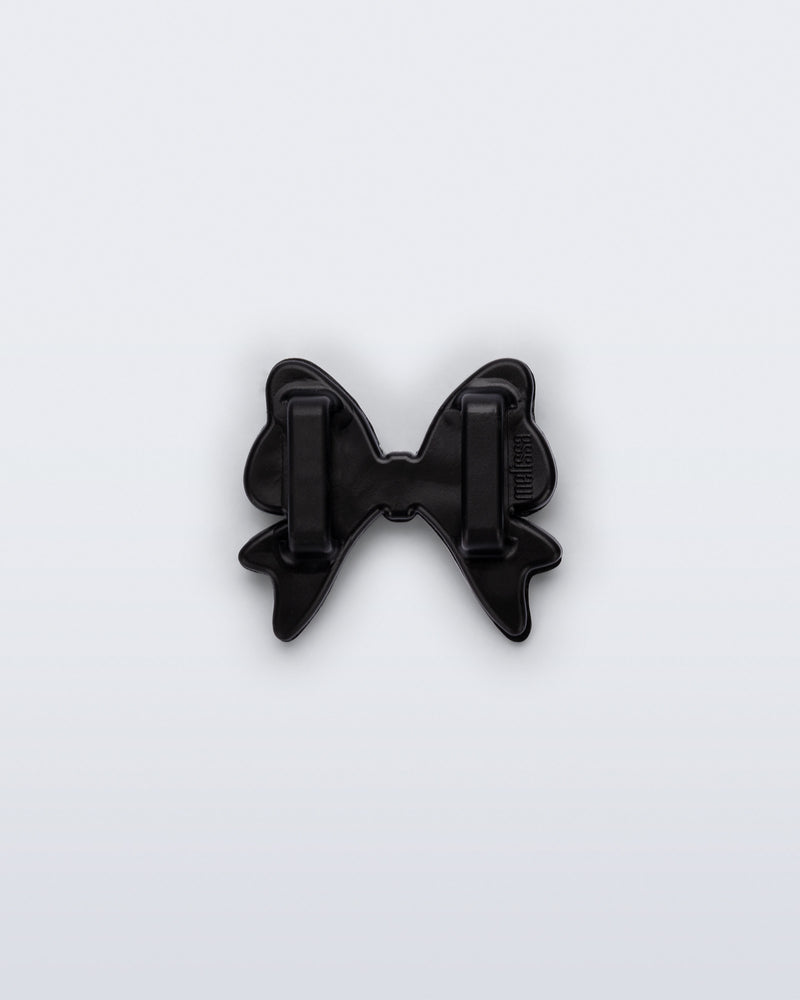 Back view of a black bow shoe charm