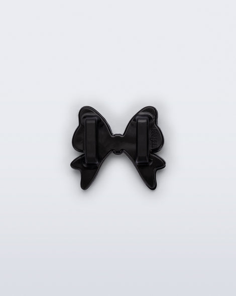 Back view of a black bow shoe charm