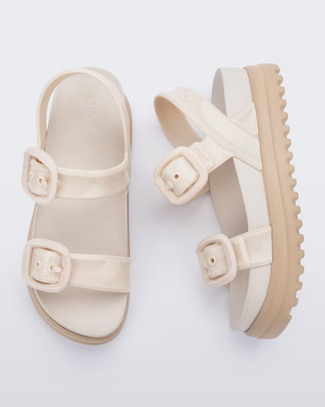 Top and side view of a pair of beige Cozy Sandal Platforms