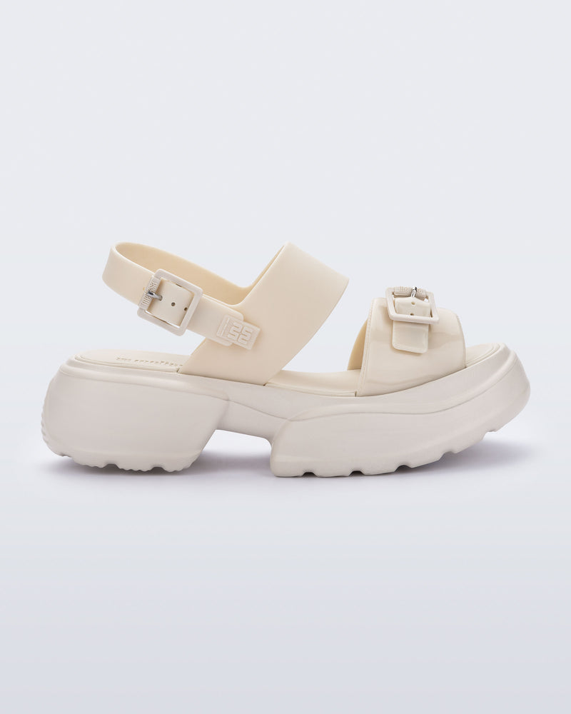 Side view of a beige Push platform Sandal 