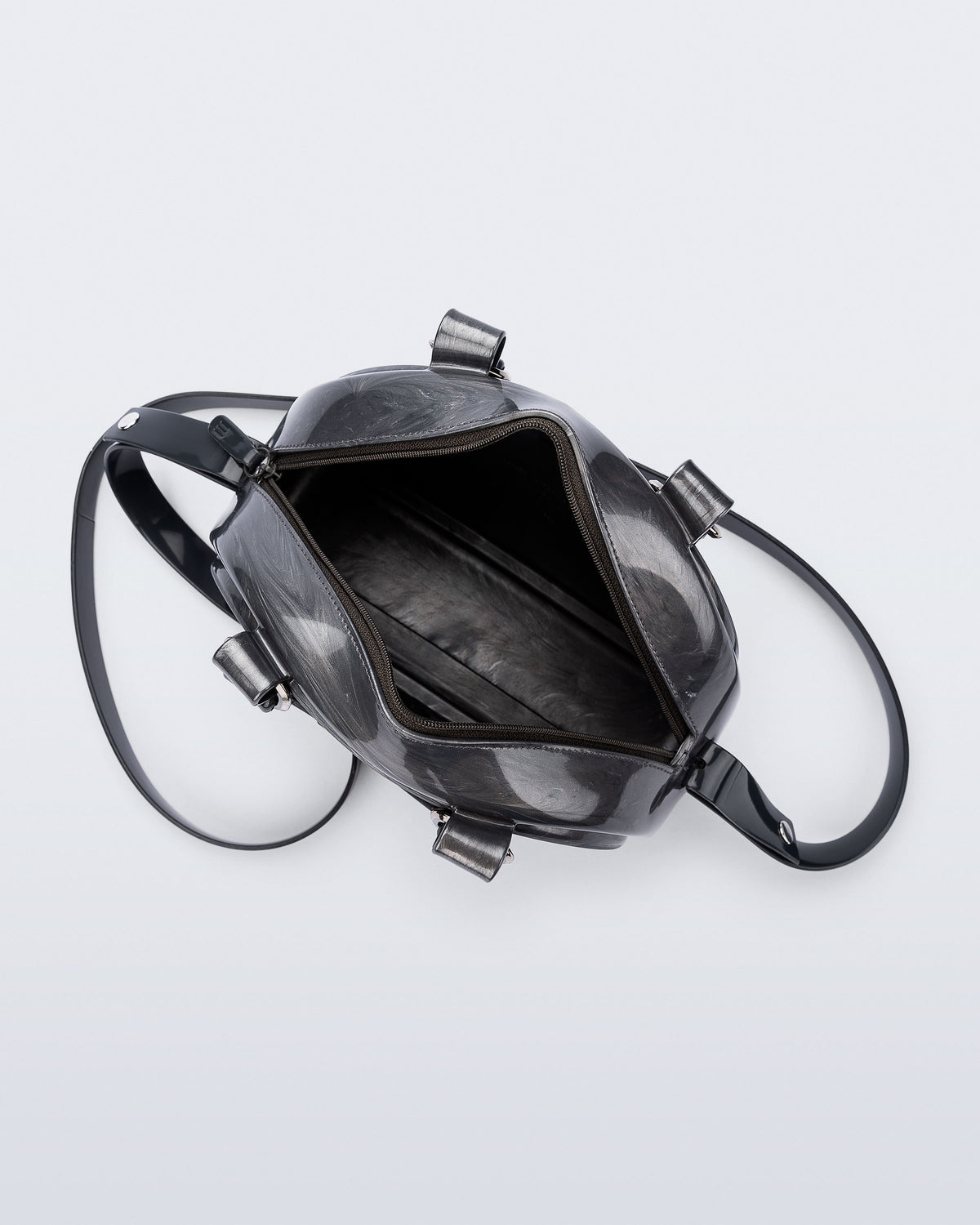 Top view of a grey Bowling bag with black handle strap and cross body strap