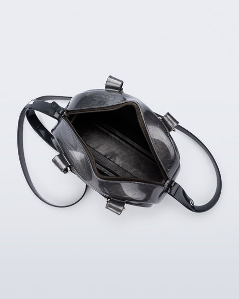 Top view of a grey Bowling bag with black handle strap and cross body strap