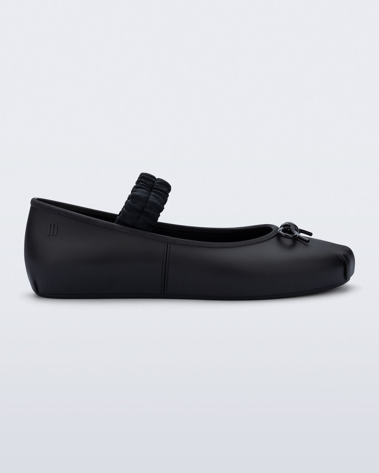 Side view of a black Sophie Scrunch flat