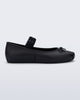 Side view of a black Sophie Scrunch flat