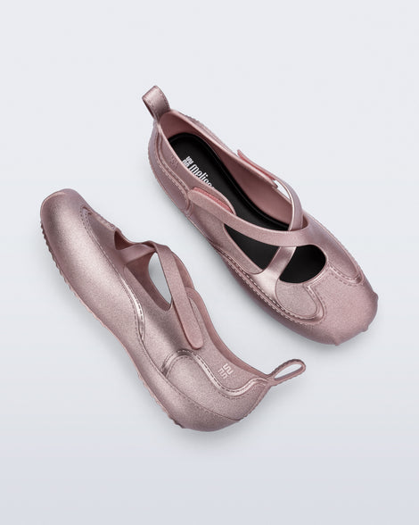 Top and side view of a pair of pearly pink Aira flats with top straps