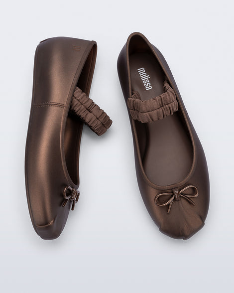 Side and top view of a pair of bronze Sophie Scrunch flats