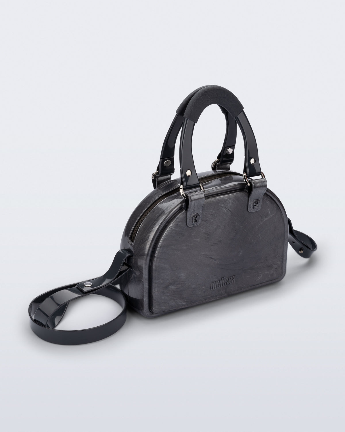 Angled view of a grey Bowling bag with black handle strap and cross body strap