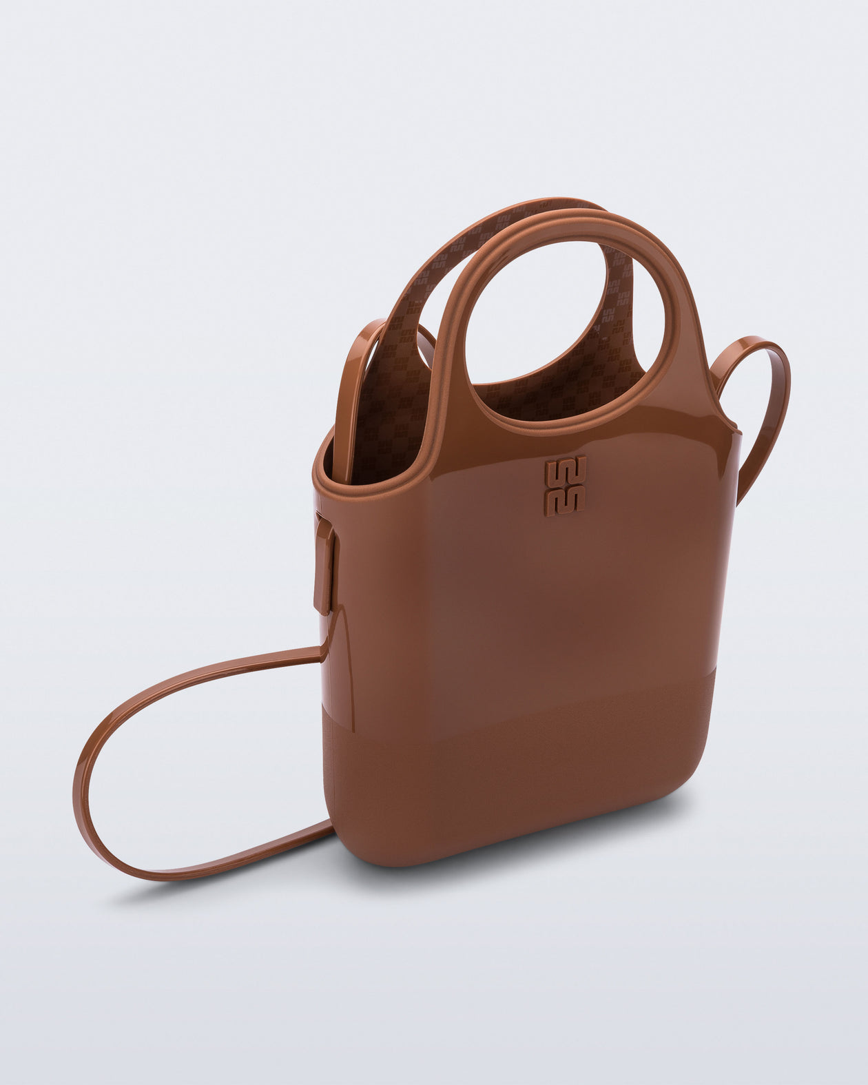 Angled view of a light brown Ultra Bag with handle and strap
