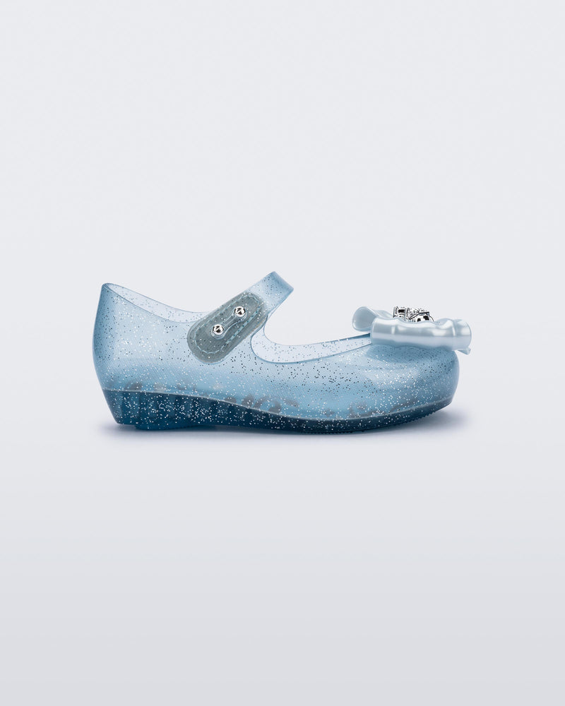 Side view of a glitter blue Ultragirl Princess ballerina baby flat with bow on top and silver details