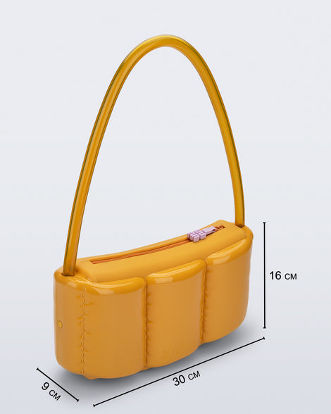 Angled view of a yellow Airflow bag with shoulder strap with bag dimensions 30 cm x 9 cm x 16 cm