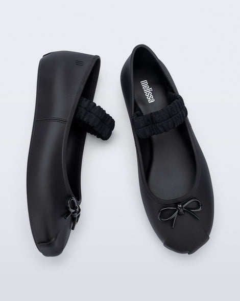 Side and top view of a pair of black Sophie Scrunch flats