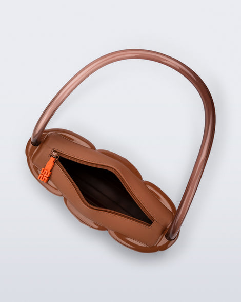 Top view of a brown Airflow bag with shoulder strap