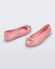 Back and angled view of a pair of pink Sweet Love Chrome flats with metallic pink bow