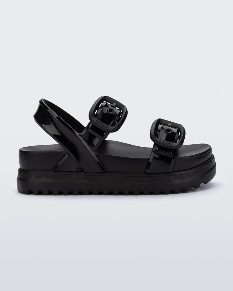 Side view of a black Cozy Sandal Platform